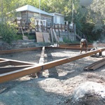 Welders working on structural steel outside